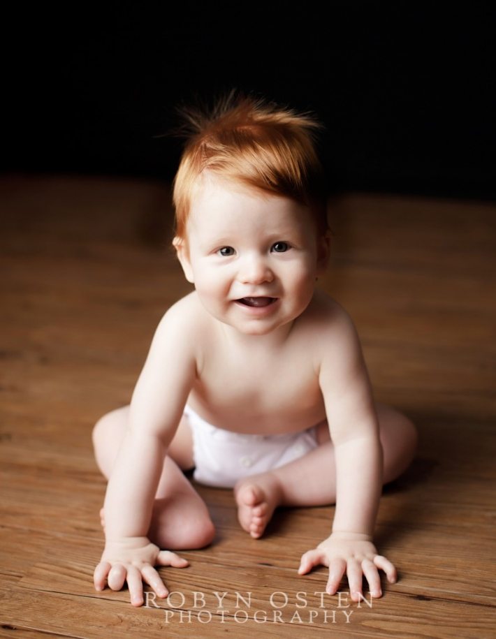 Red head baby boy classic portrait with studio lighting